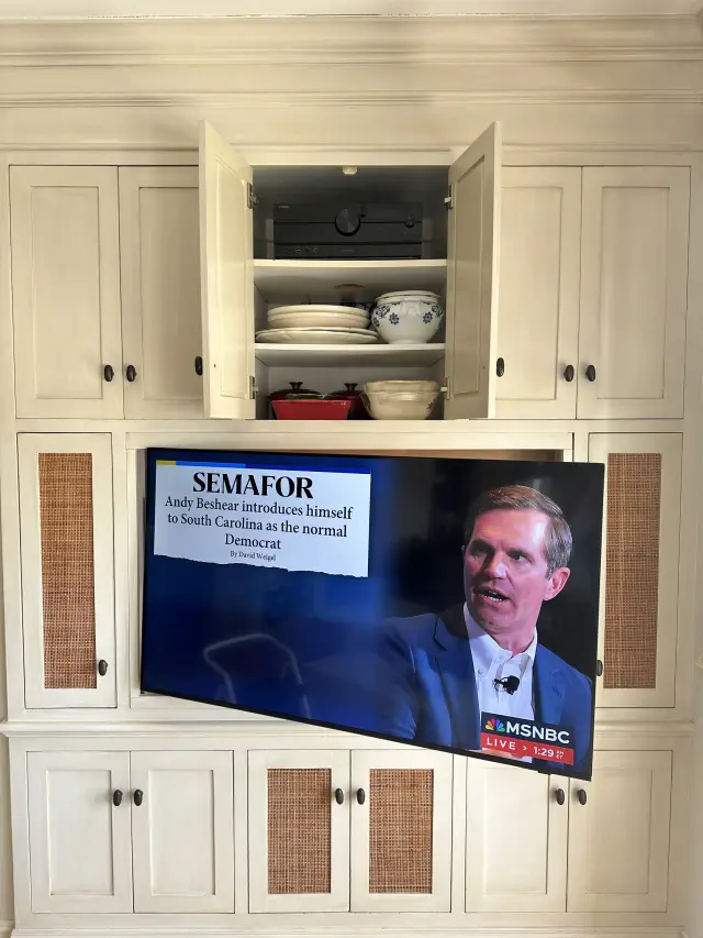 Articulating television mount installation integrated into custom cabinetry