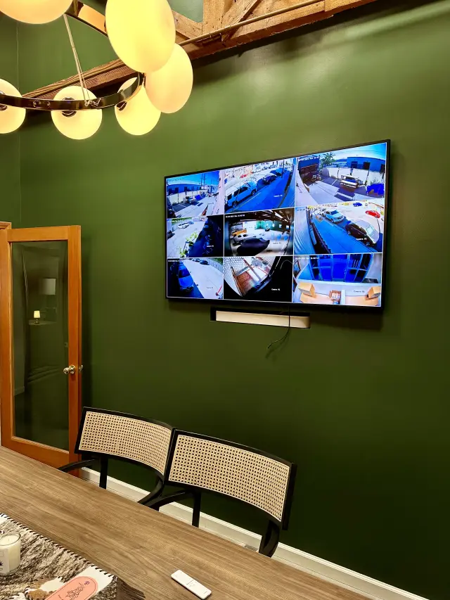 Commercial display installation with integrated security camera monitoring system