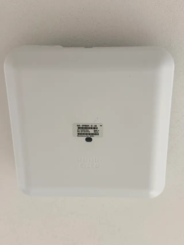 Commercial wireless access point installed flush on a ceiling