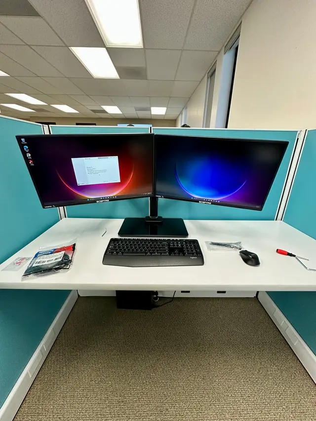 Dual monitor cubicle workstation deployed during an office PC rollout