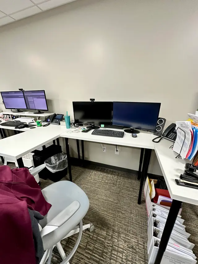 Dual screen office computer installation with desk phone