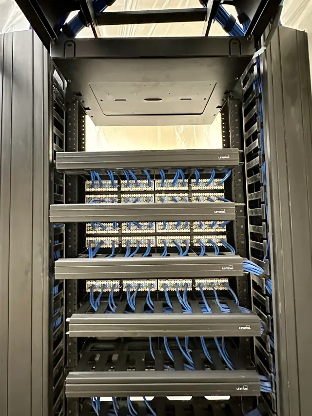 Full rack of terminated patch panels in a hospital IDF buildout