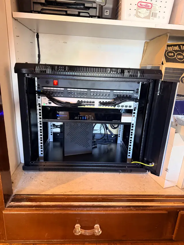 IT closet wall rack buildout with switch and cable management