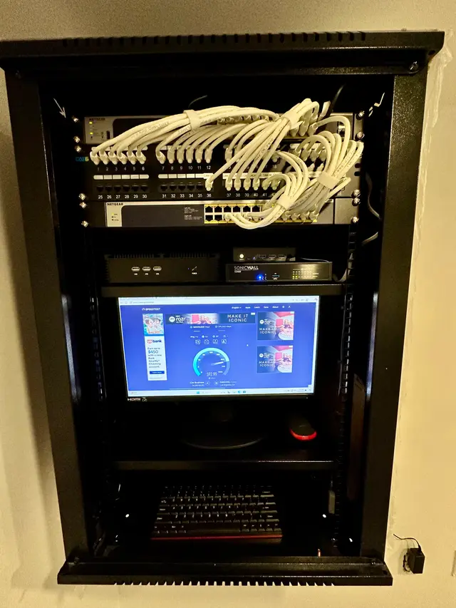 Locking glass-door network cabinet with monitoring display installed