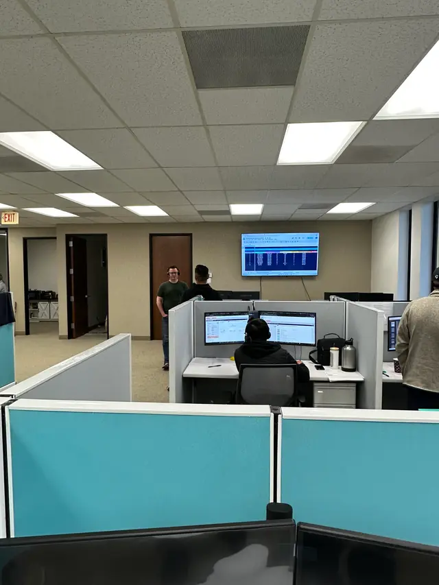 Rows of cubicle workstations during a company-wide PC deployment in Orange County