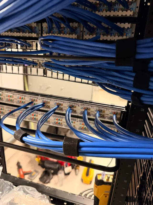 PoE switches fed by dressed Cat6 cable bundles