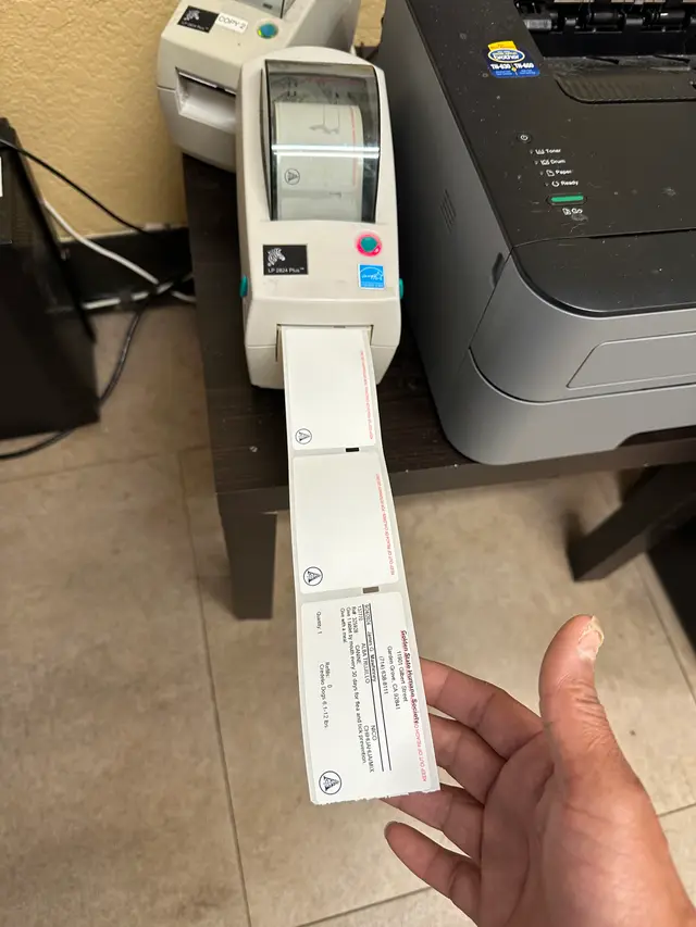 Shipping label printer configured and printing