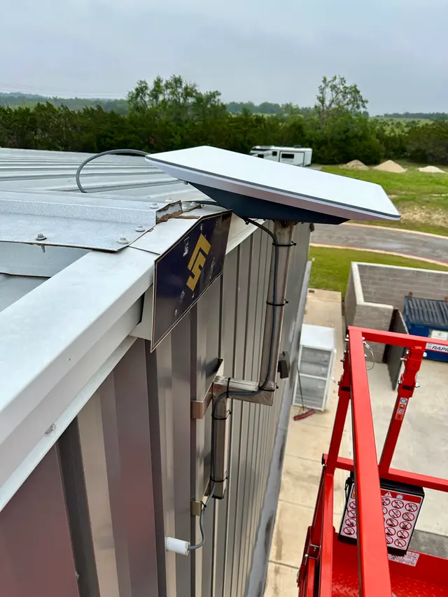 Starlink satellite internet dish installed on a commercial roof