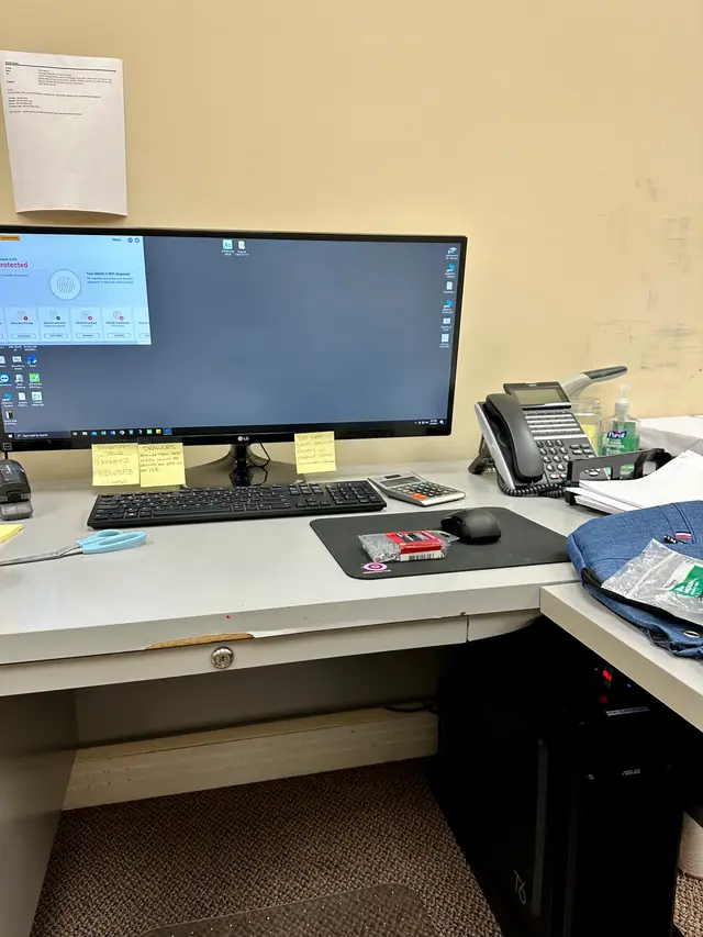 Ultrawide monitor business workstation with VoIP desk phone, set up and configured