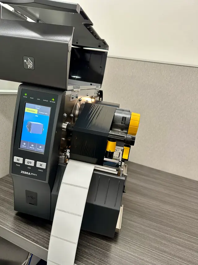 Zebra thermal label printer installed at a shipping station